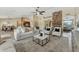 Spacious living room with a stone fireplace, neutral decor, and ample natural light at 616 E Lavitt Ln, Phoenix, AZ 85086