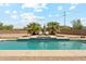 Backyard pool featuring brick detailing and patio furniture at 616 E Lavitt Ln, Phoenix, AZ 85086