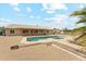 Backyard pool with gravel and lounge chairs at 616 E Lavitt Ln, Phoenix, AZ 85086