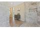 Walk-in shower with glass surround and decorative tile at 616 E Lavitt Ln, Phoenix, AZ 85086