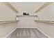 Walk-in closet with shelving for storage and organization at 616 E Lavitt Ln, Phoenix, AZ 85086