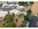 Aerial view of home with solar panels, a covered patio, and desert landscaping at 662 S Saddle St, Gilbert, AZ 85233