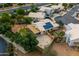 Aerial view of home with solar panels, large backyard, and a covered patio at 662 S Saddle St, Gilbert, AZ 85233