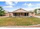 Charming home featuring a covered patio and spacious grassy backyard at 662 S Saddle St, Gilbert, AZ 85233