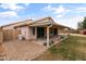Cozy home featuring a covered patio and a low-maintenance landscaped backyard at 662 S Saddle St, Gilbert, AZ 85233