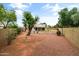 Spacious backyard featuring gravel, desert landscaping and mature trees at 662 S Saddle St, Gilbert, AZ 85233