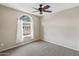 Bright bedroom with neutral walls, carpet, a ceiling fan, and natural light at 662 S Saddle St, Gilbert, AZ 85233