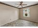 Simple bedroom with neutral walls, a ceiling fan, and vinyl floors at 662 S Saddle St, Gilbert, AZ 85233