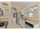 Galley kitchen showcases granite counters and stainless steel appliances at 662 S Saddle St, Gilbert, AZ 85233