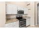 Kitchen area features stainless steel appliances and granite countertops at 662 S Saddle St, Gilbert, AZ 85233