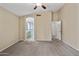 Spacious main bedroom with bathroom access and neutral carpet at 662 S Saddle St, Gilbert, AZ 85233