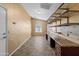 Bright office with arched window and built-in desk and shelving for organized workspace at 662 S Saddle St, Gilbert, AZ 85233