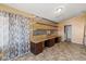 Spacious office featuring built-in desk and shelving for organized workspace at 662 S Saddle St, Gilbert, AZ 85233