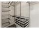 Spacious walk-in closet featuring ample shelving and metal organizers for optimal storage at 662 S Saddle St, Gilbert, AZ 85233