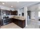 Modern kitchen boasts granite countertops, stainless steel appliances, and ample cabinet space at 6907 S 8Th Dr, Phoenix, AZ 85041
