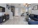 Inviting living room with sleek floors, contemporary decor, and plenty of natural light at 6907 S 8Th Dr, Phoenix, AZ 85041