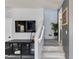 Modern staircase with sleek railings leading to the upper level of the home at 6907 S 8Th Dr, Phoenix, AZ 85041
