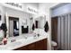Bathroom featuring double sinks and a well-lit mirror, perfect for a quick morning routine at 6932 W Harwell Rd, Laveen, AZ 85339