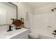 Bathroom featuring a modern vanity, framed mirror, and shower over tub at 701 W Mesquite St, Chandler, AZ 85225