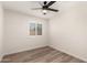 Neutral bedroom with a ceiling fan and bright window offers a calm and relaxing space at 701 W Mesquite St, Chandler, AZ 85225