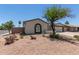 Charming home showcasing desert landscaping, complemented by a beautiful arched window at 701 W Mesquite St, Chandler, AZ 85225