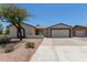 Charming single-story home featuring a desert landscape and a two-car garage at 701 W Mesquite St, Chandler, AZ 85225