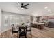 Open-concept kitchen featuring a breakfast bar, wooden cabinets, and a dining area at 701 W Mesquite St, Chandler, AZ 85225