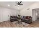 Inviting living room with wood floors, contemporary furniture, and a modern ceiling fan at 701 W Mesquite St, Chandler, AZ 85225
