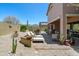 Wide-open backyard view with desert landscaping, patio seating, and privacy walls at 7144 E San Cristobal Way, Gold Canyon, AZ 85118