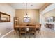 Formal dining room featuring a wooden table, six chairs, and elegant chandelier lighting at 7144 E San Cristobal Way, Gold Canyon, AZ 85118