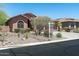Charming single-story home with desert landscaping and an inviting front yard at 7144 E San Cristobal Way, Gold Canyon, AZ 85118