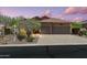 Charming home with a three-car garage, mature trees, and desert landscaping at 7144 E San Cristobal Way, Gold Canyon, AZ 85118