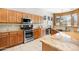 Well-equipped kitchen featuring stainless steel appliances, granite countertops, and custom cabinetry at 7144 E San Cristobal Way, Gold Canyon, AZ 85118