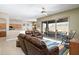 The living room features a sliding glass door leading to an outdoor seating area at 7144 E San Cristobal Way, Gold Canyon, AZ 85118