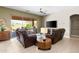 Comfortable living room with leather recliners, a media console, and a view of the patio at 7144 E San Cristobal Way, Gold Canyon, AZ 85118