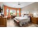 Bright and spacious main bedroom showcasing a large window, comfortable bed, and stylish furnishings at 7144 E San Cristobal Way, Gold Canyon, AZ 85118