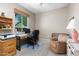 Functional home office space with natural light, a comfortable chair, and built in storage, perfect for remote work at 7144 E San Cristobal Way, Gold Canyon, AZ 85118