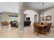 Spacious open-concept living and dining area with tile flooring and comfortable seating at 7144 E San Cristobal Way, Gold Canyon, AZ 85118