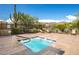 Inviting spa features clear blue water, desert landscaping, and a clear view of the sky at 7144 E San Cristobal Way, Gold Canyon, AZ 85118
