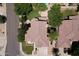 Gorgeous home featuring mature trees, lush landscaping, complemented by a three-car garage, enhancing the property's curb appeal at 7272 W Crystal Rd, Glendale, AZ 85308