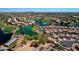 Beautiful aerial view showcasing the community with a lake and golf course at 7272 W Crystal Rd, Glendale, AZ 85308