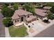 Desirable home featuring a lush lawn, mature trees, complemented by a three-car garage and easy street access at 7272 W Crystal Rd, Glendale, AZ 85308