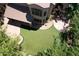 Beautiful backyard with an artificial turf area and adjacent patio at 7272 W Crystal Rd, Glendale, AZ 85308