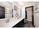 Beautiful bathroom with double sinks, stylish mirrors, and a connecting room featuring a shower and bathtub combo at 7272 W Crystal Rd, Glendale, AZ 85308