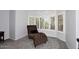 Relaxing reading corner with a bay window, a lounger, and natural light creating a serene ambiance at 7272 W Crystal Rd, Glendale, AZ 85308