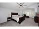 Primary bedroom featuring a bay window with white shutters, a ceiling fan, and a chaise lounge at 7272 W Crystal Rd, Glendale, AZ 85308