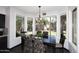 Bright dining area with backyard view and wood-look floors at 7272 W Crystal Rd, Glendale, AZ 85308