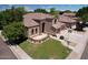 Beautiful home featuring a well-manicured lawn, mature trees, and a three-car garage, enhancing its curb appeal at 7272 W Crystal Rd, Glendale, AZ 85308