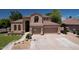 Charming home showcasing a meticulously maintained lawn and a spacious three-car garage at 7272 W Crystal Rd, Glendale, AZ 85308