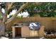 Outdoor kitchen area equipped with a grill, counter space, and storage, ideal for outdoor cooking at 7272 W Crystal Rd, Glendale, AZ 85308